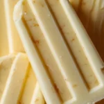 Banana pudding popsicles on a wooden plate