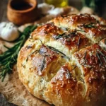 Loaf of easy roasted garlic rosemary artisan bread fresh out of the oven