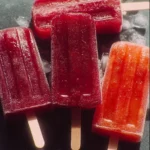 Colorful homemade popsicles made with fresh fruits and natural ingredients