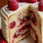 Almond Raspberry Swirl Layer Cake with rich layers and vibrant raspberry swirls