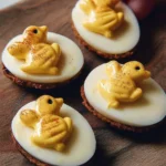 Bee-themed deviled eggs platter with honey and decorative accents.