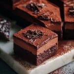 Delicious chocolate mousse brownies topped with creamy chocolate mousse