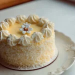 Delicious Coconut Cake topped with coconut flakes and frosting