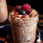 Bowl of easy brown sugar overnight oats topped with fruits and nuts