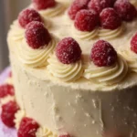 Delicious Raspberry Cake topped with creamy Lemon Buttercream frosting