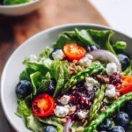 Colorful Spring Salad Delight featuring fresh greens, vegetables, and vibrant dressing