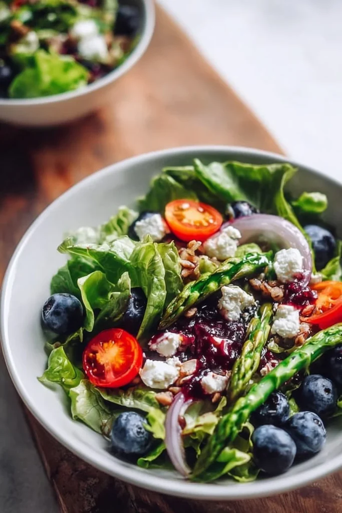 Colorful Spring Salad Delight featuring fresh greens, vegetables, and vibrant dressing