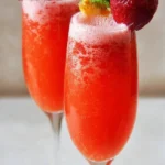 Strawberry Mimosa Mocktail with fresh strawberries and sparkling beverage