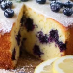 Zesty lemon blueberry cake with fresh blueberries and lemon glaze